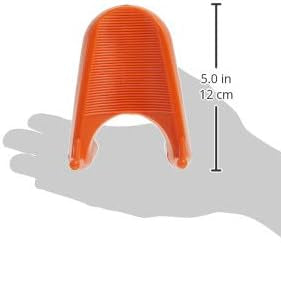 An orange, U-shaped BSN Sports universal football kicking tee with a ribbed surface, shown against a hand for scale.