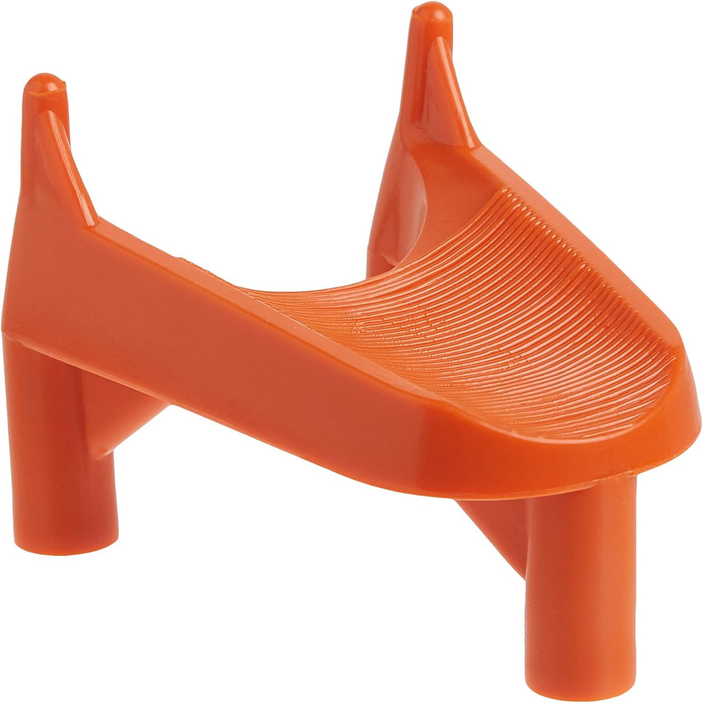 An orange molded plastic kicking tee