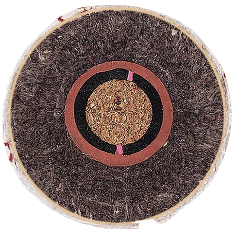 A top-down view of a Rawlings RLLB Little League baseball, showing its white leather cover, red stitching, and circular center logo.
