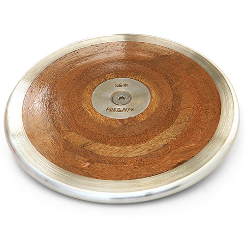 A PORTaPit Olympic wood discus featuring a polished metal rim and center plate, viewed from a high-angle perspective.