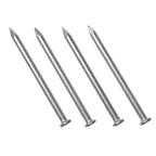 Four silver-toned, pointed metal hammer spikes for rubber bases, arranged diagonally against a white background.