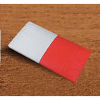 A two-toned white and red rectangular baseball double first base set at an angle against a dirt background.