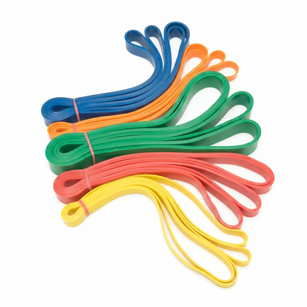 Stack of colorful resistance loop bands in blue, orange, green, red, and yellow, fanned out on a white background.