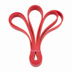 Red resistance loop bands fanned out and secured with a pink band.