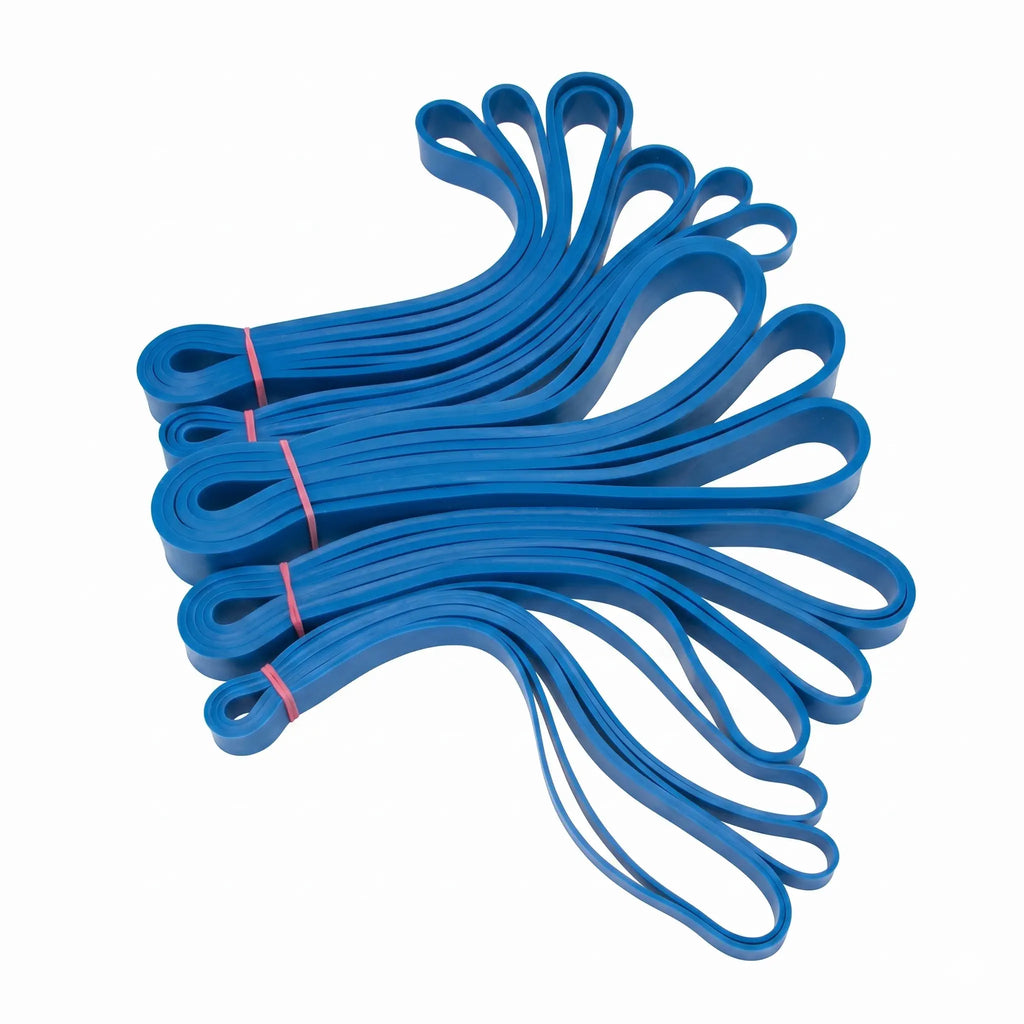 Blue resistance loop bands, some bundled with red ties, are fanned out on a white background.