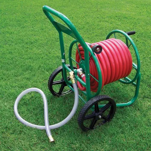 Green hose reel cart with red hose on grass.