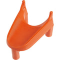 An orange, U-shaped football kicking tee with a ribbed surface and four upright prongs, viewed from a high angle.