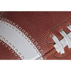 Close-up of a brown Spalding Alpha football featuring a white stripe and white laces.