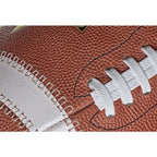 Close-up of a brown Spalding Alpha football featuring white laces and textured leather grain.