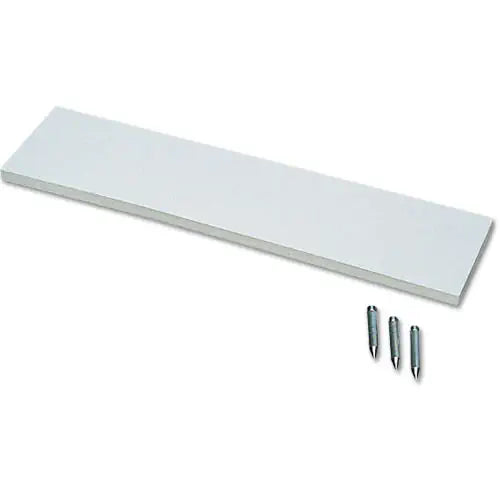 White rectangular rubber pitcher's plate shown at an angle with three metal mounting spikes below.