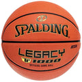 Spalding Legacy TF-1000 basketball in orange with black channels, featuring prominent gold and black brand lettering.