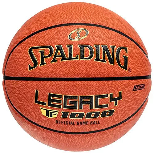 Spalding Legacy TF-1000 basketball in orange with black channels, featuring prominent gold and black brand lettering.