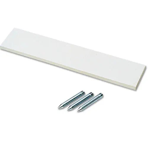 A white rectangular rubber pitcher's plate shown from a high angle with three metal mounting spikes positioned below it.