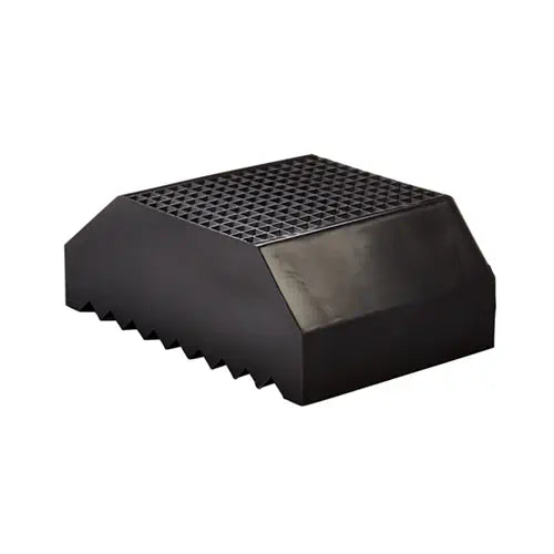 Black, rectangular Athletic Specialties Pro-Down placekick tee featuring a grid-patterned top and serrated base at a side angle.