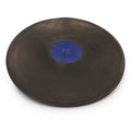 A black Nelco rubber discus with a blue center plate labeled 1K, viewed from a high-angle perspective.