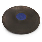 A black Nelco rubber discus with a blue center plate labeled 1K, viewed from a high-angle perspective.