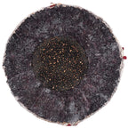 A top-down view of a Rawlings RLLB baseball, showing the dark, textured core surrounded by a grey, fibrous outer layer.