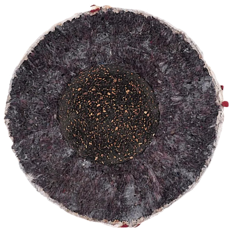 A top-down view of a Rawlings RLLB baseball, showing the dark, textured core surrounded by a grey, fibrous outer layer.